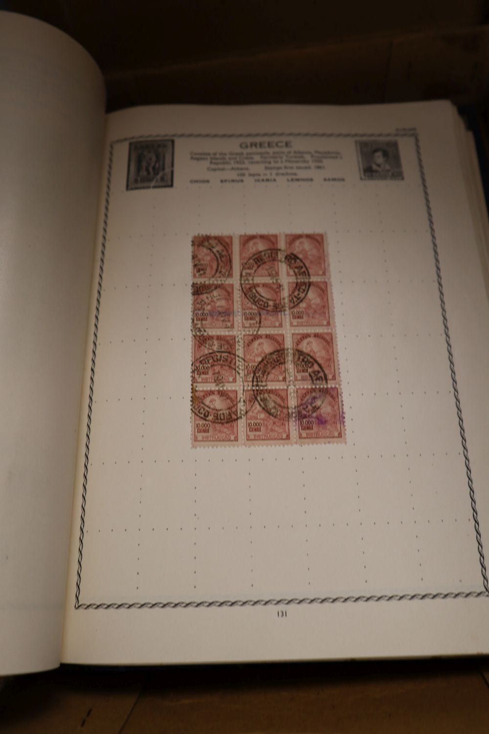 A Triumph Album containing a small collection of GB and World stamps